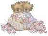 two teddybears with flowers